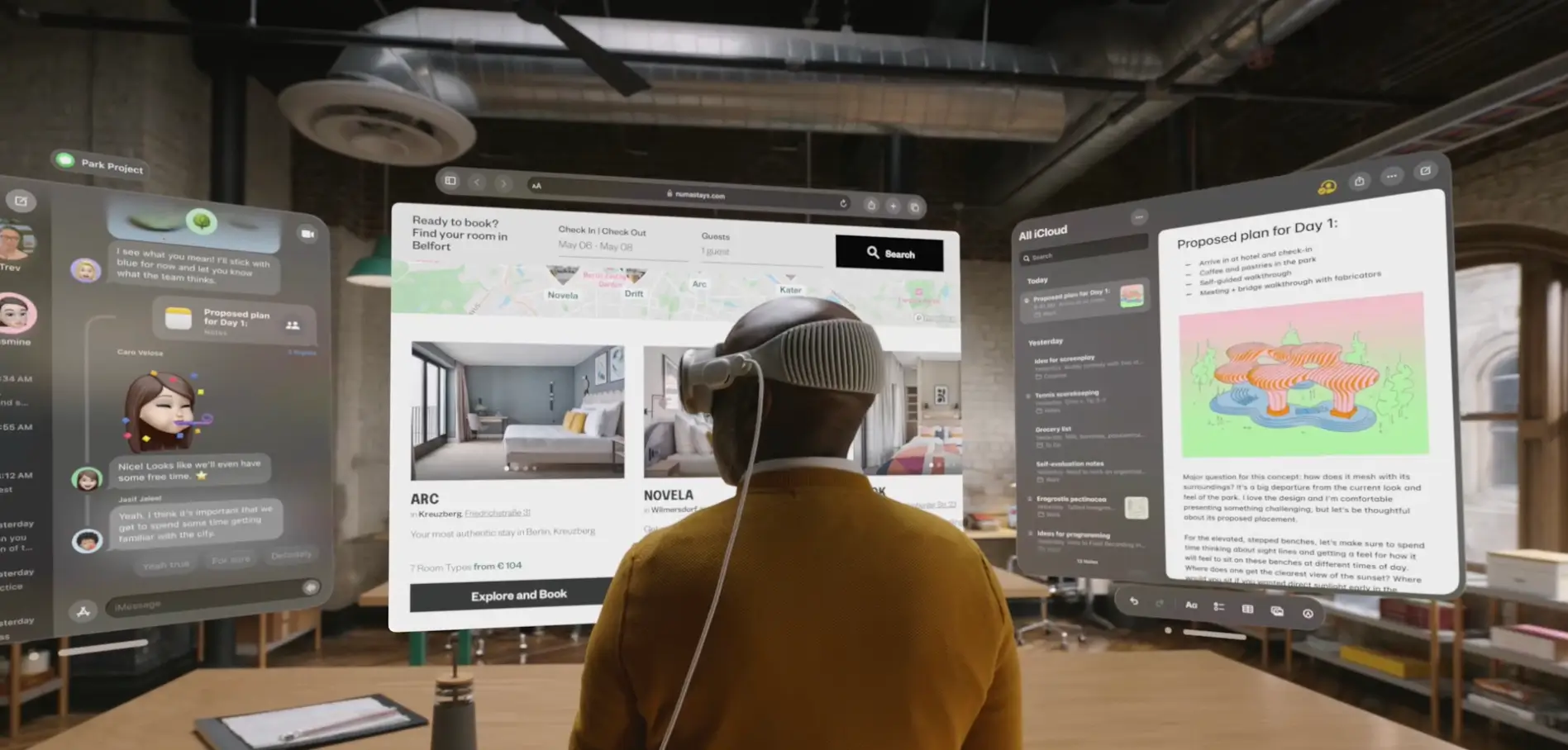A person using the Apple Vision Pro showing three transparent screens around them